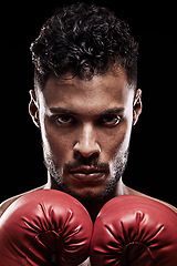 Image showing Ready, boxer and portrait of man in studio with gloves for training with strength and muscle. Adult, athlete and male person in black background, healthy and serious on face, closeup and sport