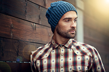 Image showing Fashion, man and thinking on wooden wall with idea for trendy, cool and style for urban outdoor. Male person, choice and planning for weekend or holiday with winter outfit and stylish in Germany