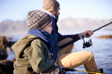 Image showing Water, father and son fishing in nature, outdoor and dad teaching boy in lake for bonding together. Parent, male person and man with kid for adventure in seaside, happiness and smile of child