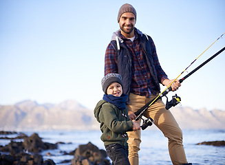 Image showing Father, kid and happy for fishing at sea in winter as hobby with bonding for child development, growth and life skills in Australia. Man, boy and stand at coast for family tradition, memory and care