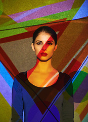 Image showing Surreal, abstract and portrait of woman by color, art and pattern of shapes serious for creative career. Light, female person and lady by wall with face for cosmetics, beauty and makeup or skin care