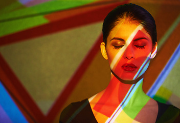 Image showing Color, abstract and woman by light with art, mockup and pattern of shapes serious for creative career. Deco, female person and lady by wall and face for cosmetics, beauty and skin care or treatment