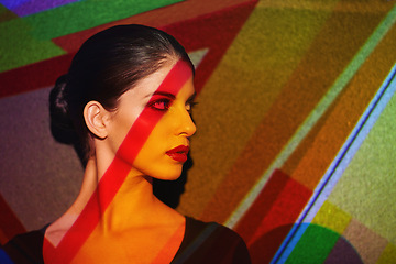 Image showing Color, abstract and face of woman by art, light and pattern of shapes serious for creative career. Deco, female person and lady by wall with skin for cosmetics, beauty and makeup or treatment