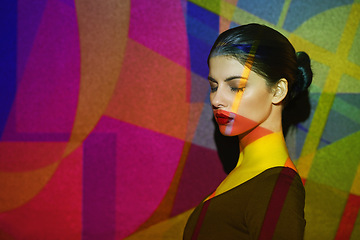 Image showing Surreal, abstract and face of woman by color, art and pattern of shapes serious for creative career. Light, female person and lady by wall with skin for cosmetics, beauty and makeup or treatment