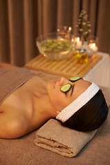 Image showing Skincare, relax and woman with cucumber on face for massage in spa for peace, calm or wellness. Facial, salon and person with vegetable on eyes in therapy, natural beauty or healthy organic treatment