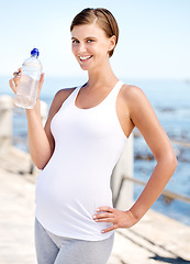 Image showing Pregnant woman, water bottle and outdoor at beach with prenatal health, fitness with h2o and ocean. Nutrition, pregnancy and thirsty mom, hydration and exercise in portrait with drink for wellness