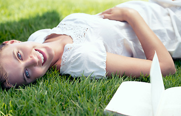 Image showing Pregnant, spring and portrait of woman reading book in nature outdoor for relax, wellness and peace on field. Pregnancy, literature and mother lying down for happiness, leisure and stomach in garden