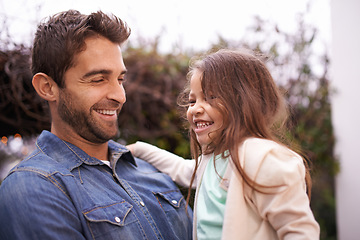 Image showing Family, smile and father carry girl for bonding, outside and fun for quality time. Laugh, parent and young daughter with love in nature, embrace and happiness for vacation or travel with dad