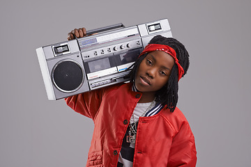 Image showing Child, hip hop and portrait with radio for rap music and dance in a studio with urban clothing. Fashion, African kid and boombox with trendy clothes and youth swag with confidence and grey background