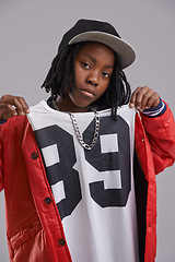 Image showing Studio, portrait and boy with hip hop for fashion with clothes for aesthetic of culture for youth. Grey background, teenager and child with swag, cool and kid with trendy style of confidence