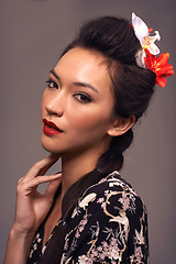 Image showing Japanese woman, portrait and culture in studio, beauty and traditional aesthetic on brown background. Female person, cosmetics and self care for dermatology, heritage and attitude for serious makeup