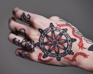 Image showing Person, hands and tattoo for creative and ink for design, picture and symbol for red on closeup. Art, bold and cool for black and statement for funky, trendy and vibrant for unique, edgy and artistic