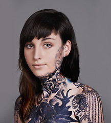 Image showing Woman, portrait and beauty with tattoo for haircare, style or facial treatment on a gray studio background. Face of female person or young model with confidence for body art, design or creativity