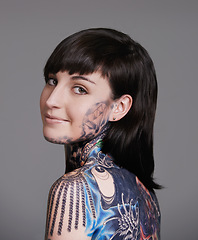 Image showing Happy woman, portrait and beauty with back tattoo for haircare, style or facial treatment on a gray studio background. Face of female person, young model or smile for body art, design or creativity
