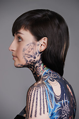 Image showing Woman, tattoo and ink for creative, body and design for picture and symbol for blue and colourful. Young person and look with art for bold, cool and statement for funky, trendy and unique for edgy