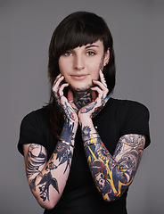 Image showing Happy woman, portrait and stylist with tattoo for facial treatment, style or body art on a gray studio background. Female person, young model or smile for design, creativity or cool beauty artist