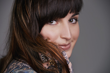 Image showing Happy woman, portrait and beauty with tattoo for haircare, style or facial treatment on a gray studio background. Face of female person or young model with smile for body art, design or creativity
