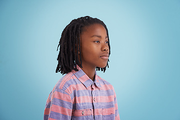 Image showing Children, thinking and black boy in studio why questions, memory or reflection on blue background. Brainstorming, remember and African teen model with vision for solution, problem solving or guess