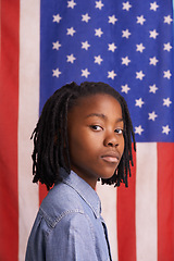 Image showing Portrait, children and black boy with American flag in studio for freedom, event or patriotic pride. Face, immigration and African kid with USA poster for Memorial Day, history or human rights banner