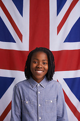 Image showing Child, portrait and happy with UK flag or backdrop for citizenship, government and human rights. Smile and face of black kid, student or boy from united kingdom and Union Jack background for support