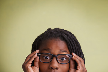 Image showing Glasses, mockup or boy kid portrait in studio for eye care, wellness or optometry on green background. Frame, space or face of teen male model with eyesight, prescription or vision, optics or testing