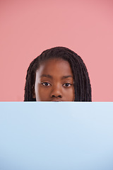 Image showing Poster, portrait or boy child with mockup in studio for announcement, offer or info on pink background. Banner, face or teen model with billboard presentation for news, promotion or voice and opinion