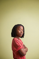 Image showing Portrait, thinking and boy child with arms crossed in studio for solution, confidence or wondering on green background. Doubt, face and African teen model with gesture for suspicious body language