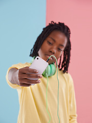Image showing Teen, student and selfie of boy in studio with headphones for listening to music with lgbt youth in high school. Trans, blog and post on social media about queer identity and pride in profile picture