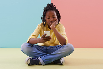 Image showing Phone, search and bored boy child on a floor with social media, reading or ebook in his home. Smartphone, lazy or African teen with app for Netflix and chill sign up, google ir or watching video