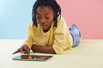 Image showing Tablet, search and African boy child on floor with social media, ebook or cartoon at home. Digital, relax or teenage person with app for Netflix and chill sign up, google it or gaming subscription