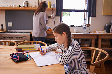 Image showing Girl, child and homework with writing in kitchen for studying, development and notes for education in house. Kid, notebook and thinking with learning, language and ideas for assessment in family home