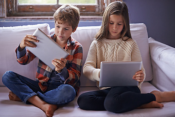Image showing Brother, sister and tablet for gaming on couch together, technology and online streaming for bonding at home. Digital .world, internet and children in living room, gamer app or elearning with ebook