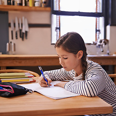 Image showing Girl, child and homework with studying in kitchen with writing, development or notes for education in house. Kid, notebook and thinking with learning, language and ideas for assessment in family home