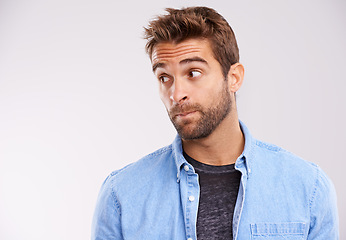 Image showing Thinking, confused and man with ideas, unsure or uncertain on white studio background with solution or emoji. Person, model or guy with thought or question with why and emotion with reaction or doubt