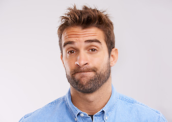 Image showing Studio, portrait and bored man with doubt, frustrated and confused on white background. Opinion, disappointment and face of person with decision, conflict or uncertainty for choice, news or ideas