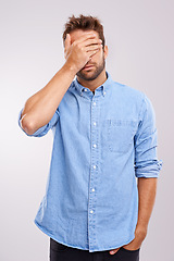 Image showing Regret, stress and face palm with man in studio for embarrassment, thinking and headache. Sad, shame and tired male person with anxiety, fatigue and bad memory on white background with hand on head