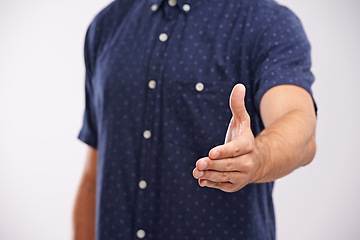 Image showing Handshake, closeup and welcome person in studio, background and introduction in mockup space. Hand, gesture and networking for business with confidence and say thank you for agreement or offer