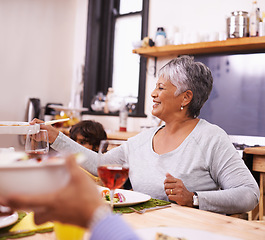 Image showing Mature, happy woman and family with food for thanksgiving dinner, meal or serving at the table. Senior and hungry grandmother with smile for dining, eating or lunch in happiness together at the house