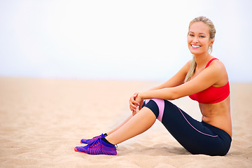 Image showing Fitness, smile and portrait of woman on beach for exercise, training and workout in nature. Yoga, sports and person on sand for warm up, rest and relax for wellness, health and performance by ocean