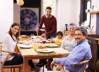 Image showing Happy, portrait and big family with food at dinner table for thanksgiving, bonding or get together at home. Grandparents, parents and grandchild with smile in happiness for meal, feast or weekend