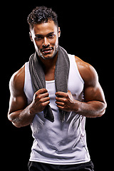 Image showing Fitness, portrait and strong man in studio with muscle, confidence and workout for health, wellness and power. Smile, towel and athlete on black background for exercise, results and sports challenge