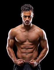 Image showing Fitness, portrait and man in studio with muscle, confidence and workout routine in health, wellness and power. Flexing, pride and strong athlete on black background for exercise, results and care