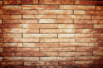 Image showing Closeup, brick wall and texture with pattern, architecture and wallpaper with building and structure. Empty, cement and light with stone and color with solid and exterior with design and concrete