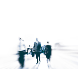 Image showing Business people, blurry and walking for commute in city for travel, work and profession in urban for move and trip in street. Young person or pedestrian and rush for transport for job on motion blur