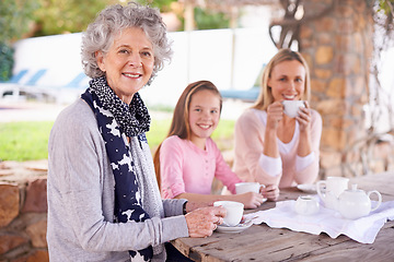 Image showing Woman, child and relax with tea for fun, generations in park together for bonding with love. Family time, mother and happy grandma and smile for summer garden picnic, cups and teapot for beverage