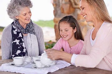 Image showing Woman, child and relax with tea for fun, generations in park together for bonding with love. Family time, mother and happy grandma and smile for summer garden picnic, cups and teapot for beverage