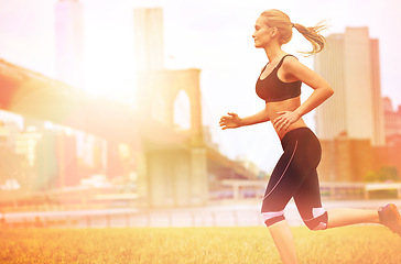 Image showing Woman, healthy and running for fitness in city, jogging active and happy female person exercising in New York. Energy, marathon or sports training or workout, cardio for endurance wellness or flare