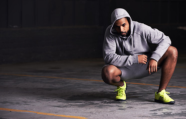 Image showing Fitness, serious and man with hoodie in parking lot for exercise, training and intense workout. Bodybuilder, sports and person for strength, wellness and health with mockup space for performance