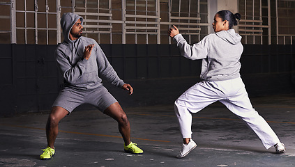 Image showing Martial arts, fight and man with woman, fitness and wellness with cardio or exercise with energy. Challenge, coach or athlete with sports or workout with competition or fighter with skill or training