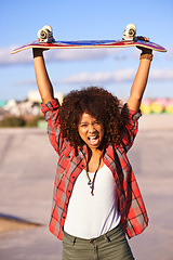 Image showing Portrait, fashion and excited black woman with skateboard in city for exercise, training and skating in skatepark. Skater, shouting and face of female person for trendy, edgy and hipster clothing